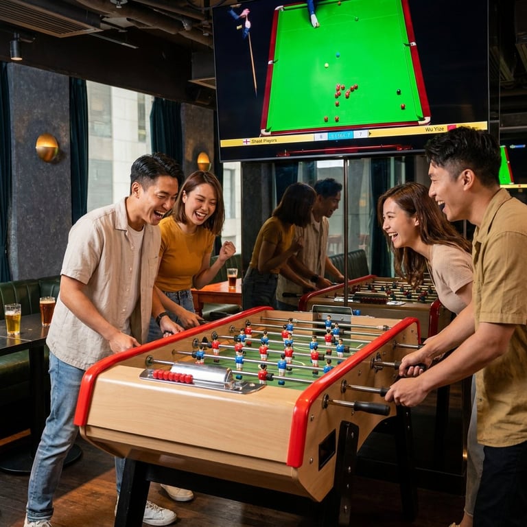 Group of young people playing foosball at an indoor game lounge with pool tables and arcade games in the background